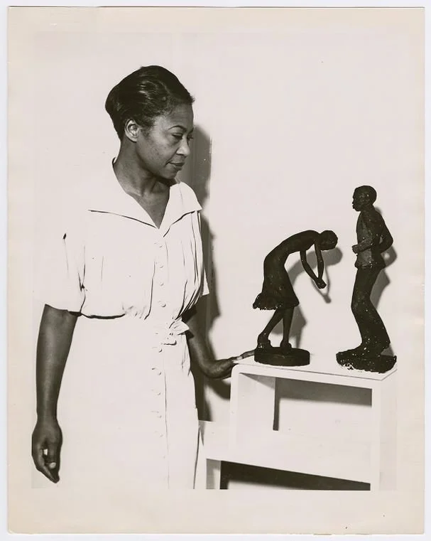 Augusta Savage with two of her statuettes, entitled (left to right) “Susie Q” and Truckin’” — Source: Schomburg Center for Research in Black Culture, Photographs and Prints Division, The New York Public Library. "Augusta Savage with two of her statue