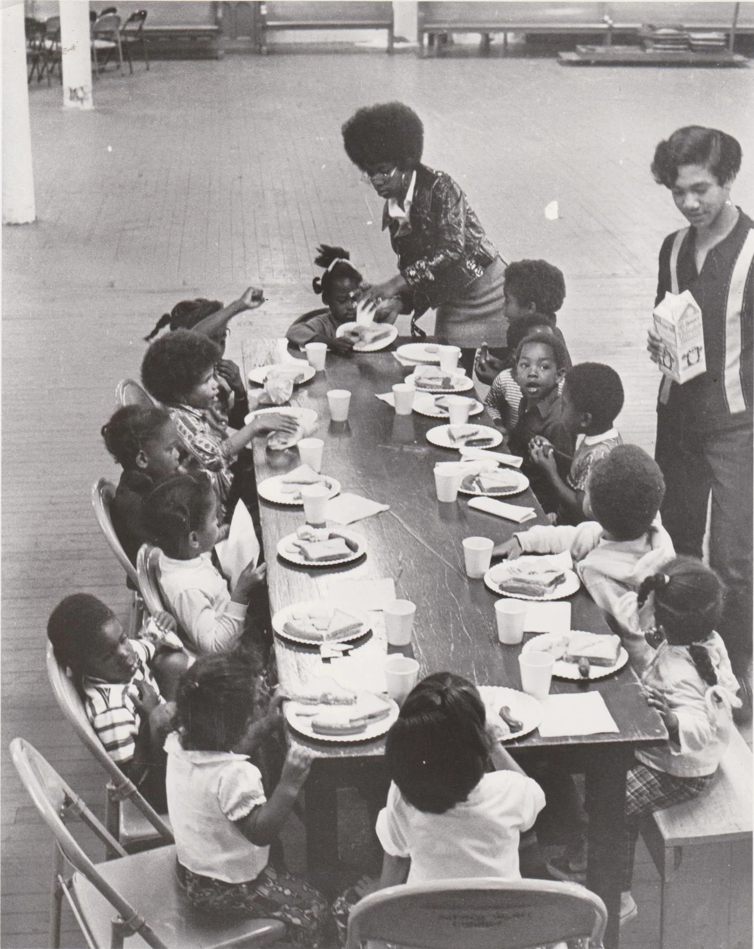 Children sit to eat at a free meal provided by the Black Panther Party. Stephen Shames and Ducho Dennis