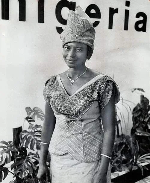 Traditional Nigerian dress and jewelry were worn by Mrs. Omobola Obiogun; one of er country's chief trade officers; on a visit to Canada and the CNE. (Photo by Harold Whyte, 1965)