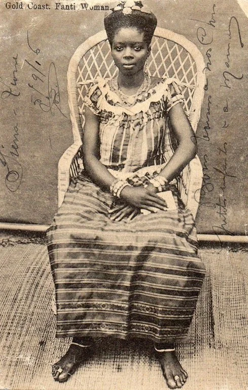 Woman from the African Coast photographed by F.W.H Arkhurst, with their hair swept high and adorned with gold ornaments. Sourced from AdireAfricanTextiles.blogspot.com.