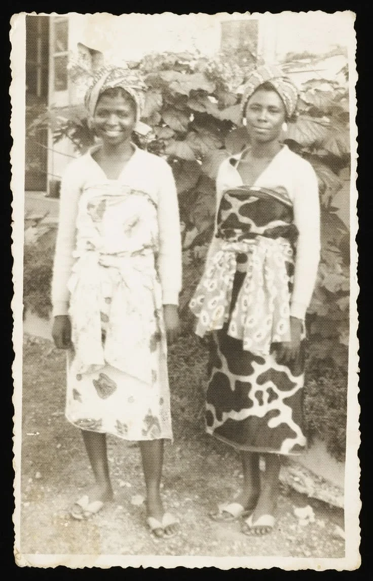 Dinah Osei and friend wearing a "wrapper" (iro), Ghana 1960s .