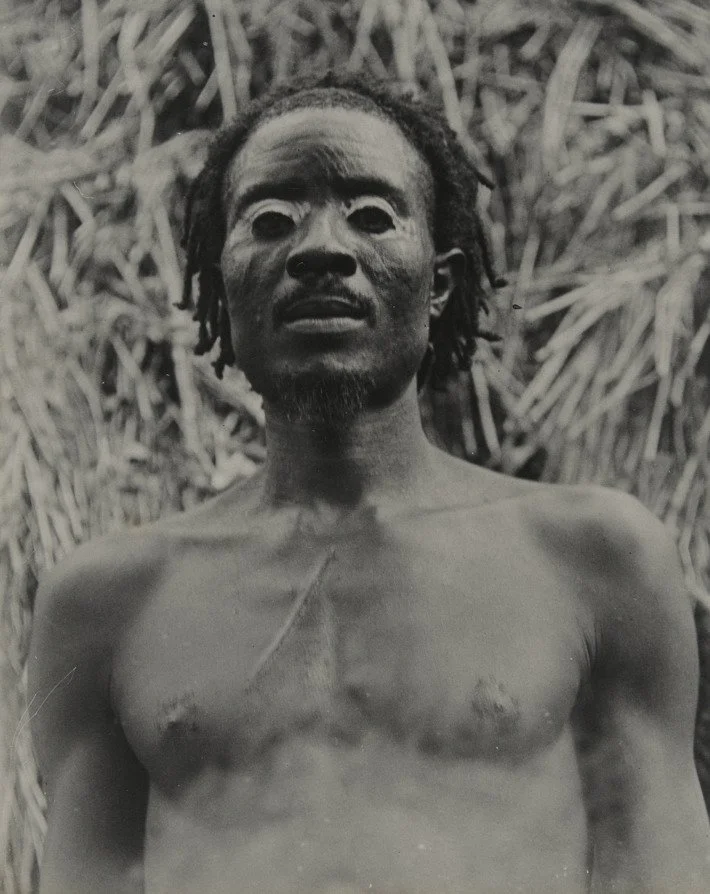 A man from Enugwu Ukwu in present day Anambra State, photographed by Northcote Thomas, c. 1910-11. MAA Cambridge. [There’s nzụ, chalk, on his eyes.]