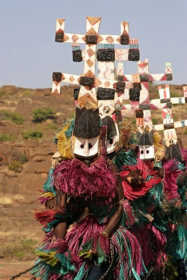 Dogon dancers wearing kanaga masks during a ceremonial procession in Mali.