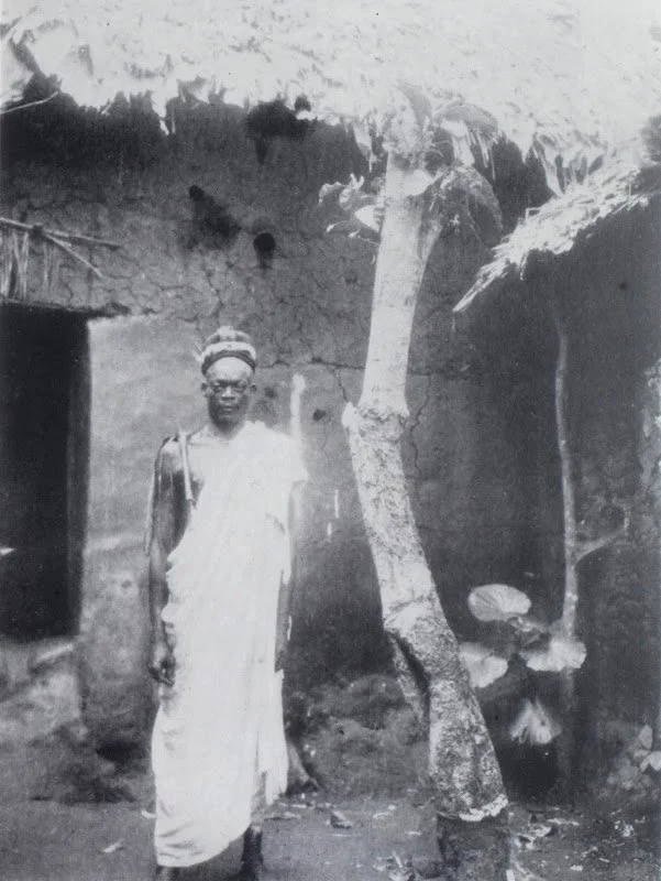 "The goddess of the earth," as described by P. A. Talbot, c. 1932. Musée du quai Branly. This may be Ala, the Igbo earth divinity and the man pictured may be an Eze Ala, a head priest of Ala. Ala is represented by trees and shrubs.