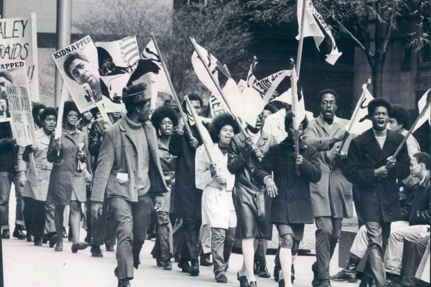 Members of the Black Panther Party march in the Loop in October 1969.