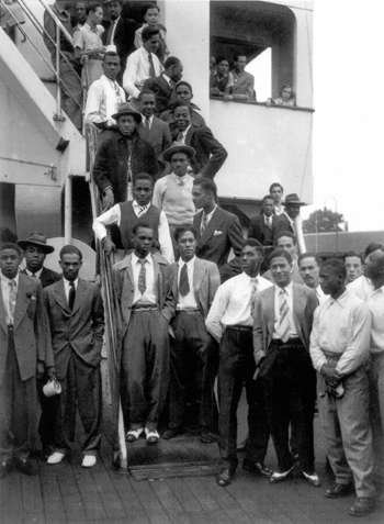 A group of Caribbean immigrants arriving in Britain post-World War II.