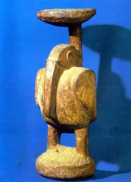 Avian Carved Figure (Possibly a Zemi Representation). Taíno culture; Jamaica, Caribbean. Wood, carved. This sculptural figure represents a stylized bird form carved from a single piece of wood. Avian imagery in Taíno cosmology often signified spiritu