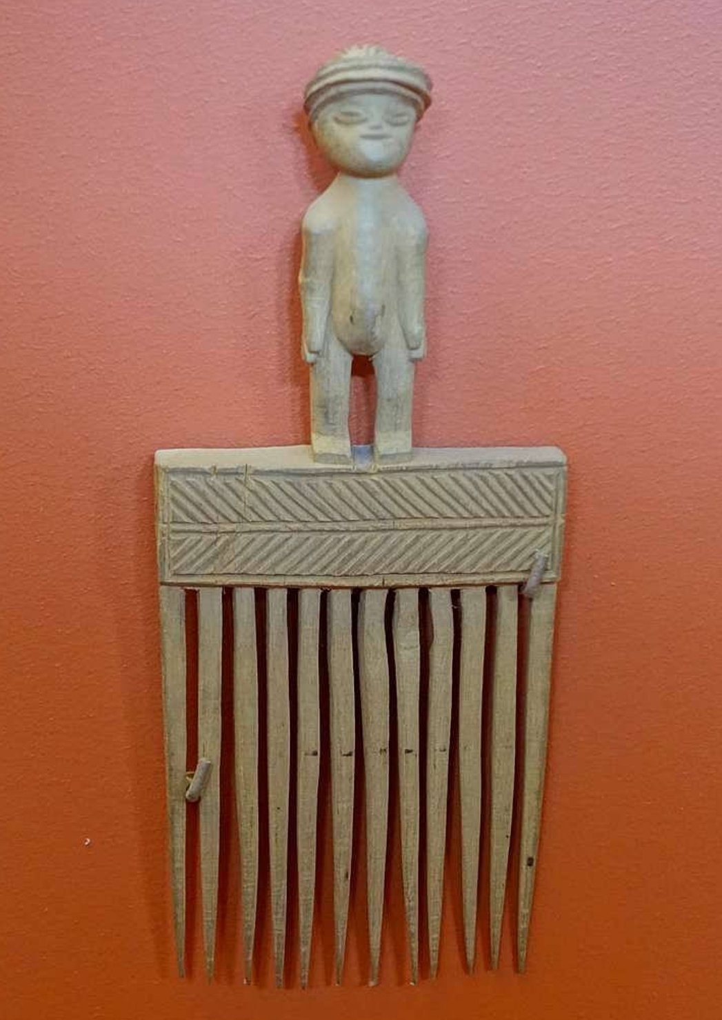 Comb made out of wood. Angola. Made out of ivory and bone. Kept in Redpath Museum, McGill University.