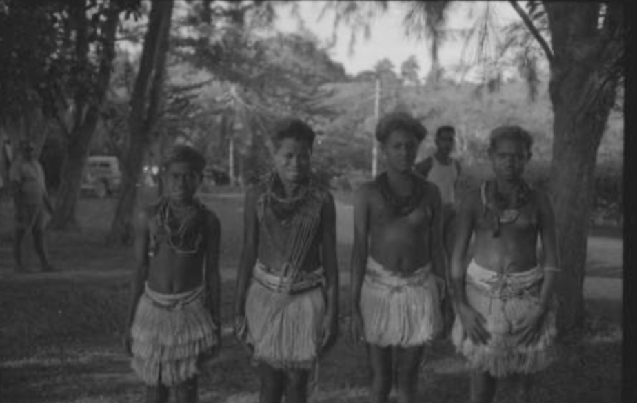 Four young girls in custom dresses sent by Moro with cash to buy their freedom. Photographed by James L.O. Tedder in 1958. Sourced from the Pacific Manuscript Bureau.