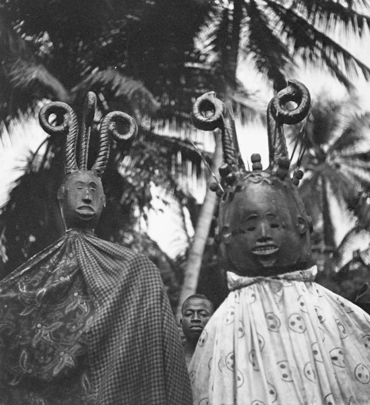 Ozu-Item tribe, Isu-Item Igbo Janus shoulder mask, Ikem masquerade. Covered in skin with hair represented by circular studs and wooden horns, with porcupine quills between them and in the mouth of one. 