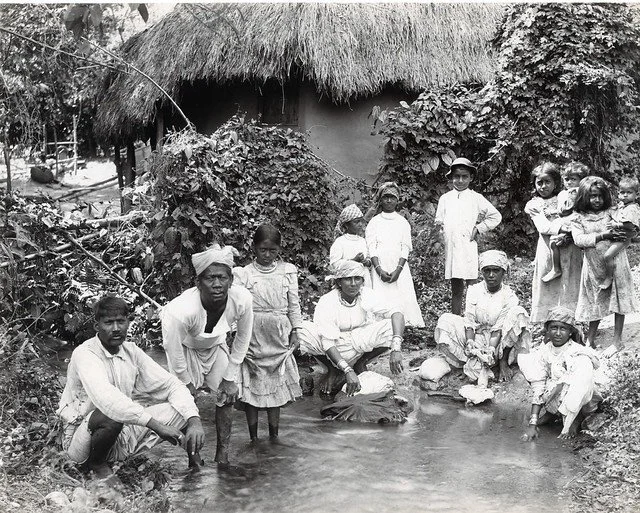 Cleary, J.W. (n.d.). Coolies Washing Clothes, Jamaica. [Photograph]. The Caribbean Photo Archive. https://www.caribbeanphotoarchive.com