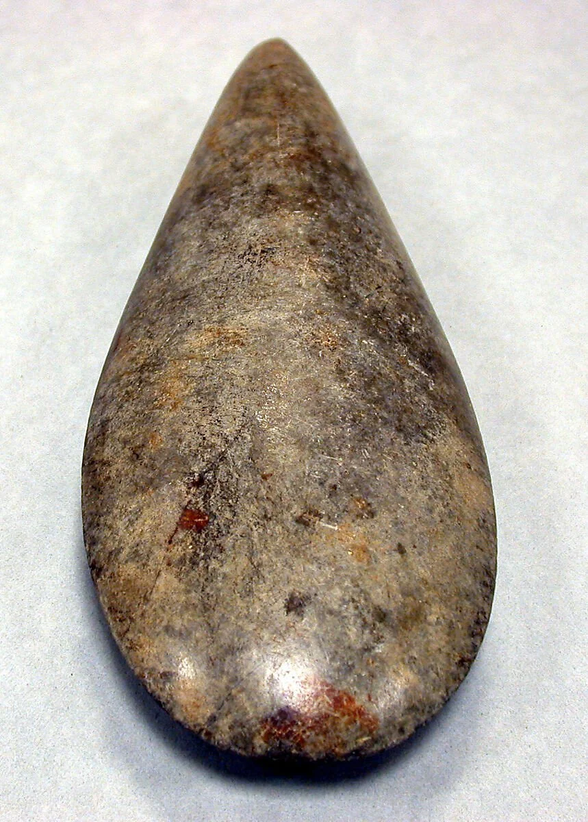 Celt. 7th–10th century. Taíno culture; Puerto Rico, Caribbean. Stone implement (Height 9 5/8 in. × Width 3 3/8 in. / 24.4 × 8.6 cm) carved and ground to a polished edge. This celt was made by Taíno craftspersons using percussion and abrasive techniqu