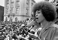 ANGELA DAVIS (1944- ).
American political activist. Davis speaking at a rally against the death penalty outside the state capitol building in Raleigh, North Carolina, 4 July 1974.