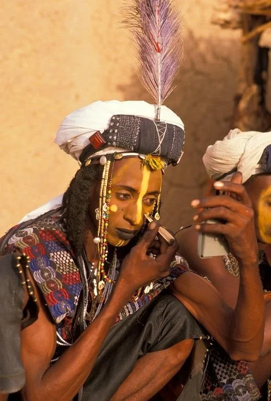 Wodaabe man getting ready for Guérewol festival Image by Michel Renaudeau 