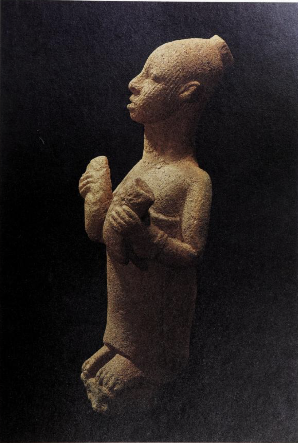 ُerracotta figure holding two buffalo horns. between the 12th and the 15th centuries A.D.  P.67 from Two thousand years, Nigerian art (1977).