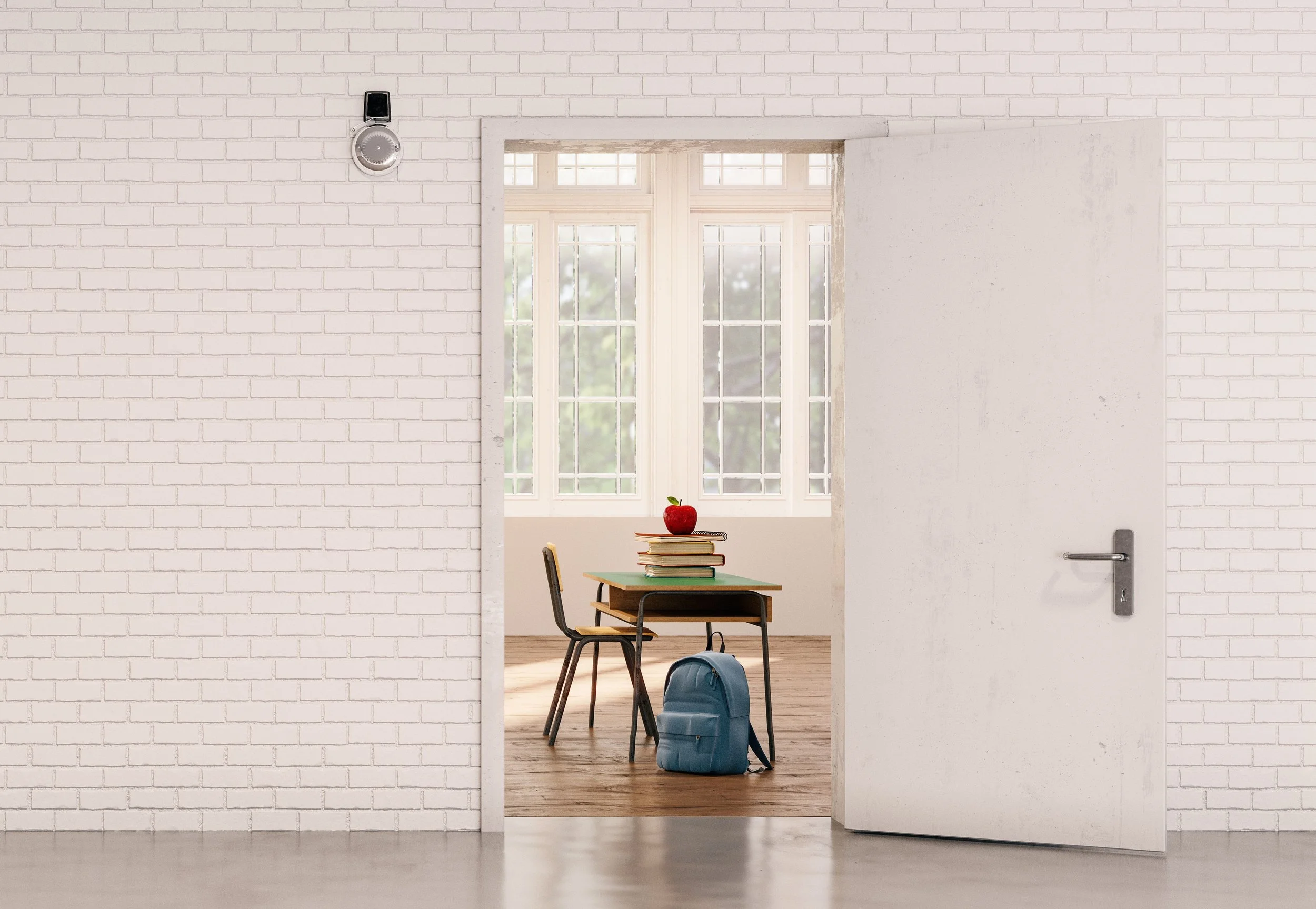 A hallway with white brick walls and a partially open white door revealing a bright room with large windows, a school desk with a blue backpack underneath, a stack of books with an apple on top, and sunlight streaming in.