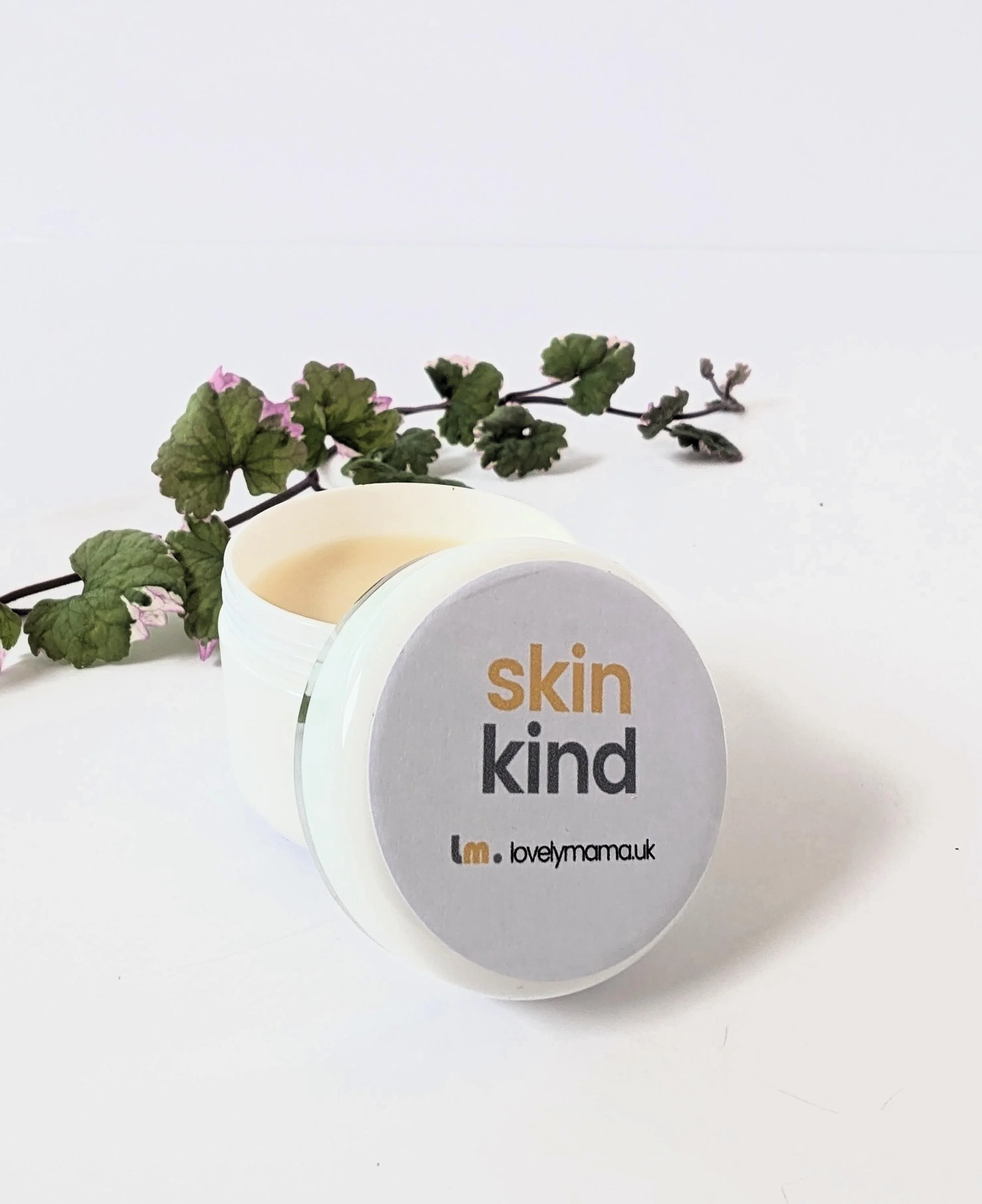 skin kind balm in white jar