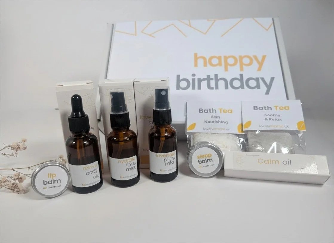 happy borthday gift box with products desplayed along side