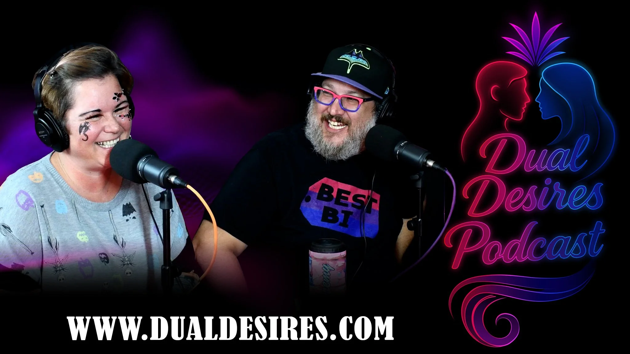 Two people recording a podcast with microphones and headphones, a woman with temporary tattoos and a man with glasses and a beard, with a neon sign that reads "Dual Desires Podcast" and a website URL at the bottom.
