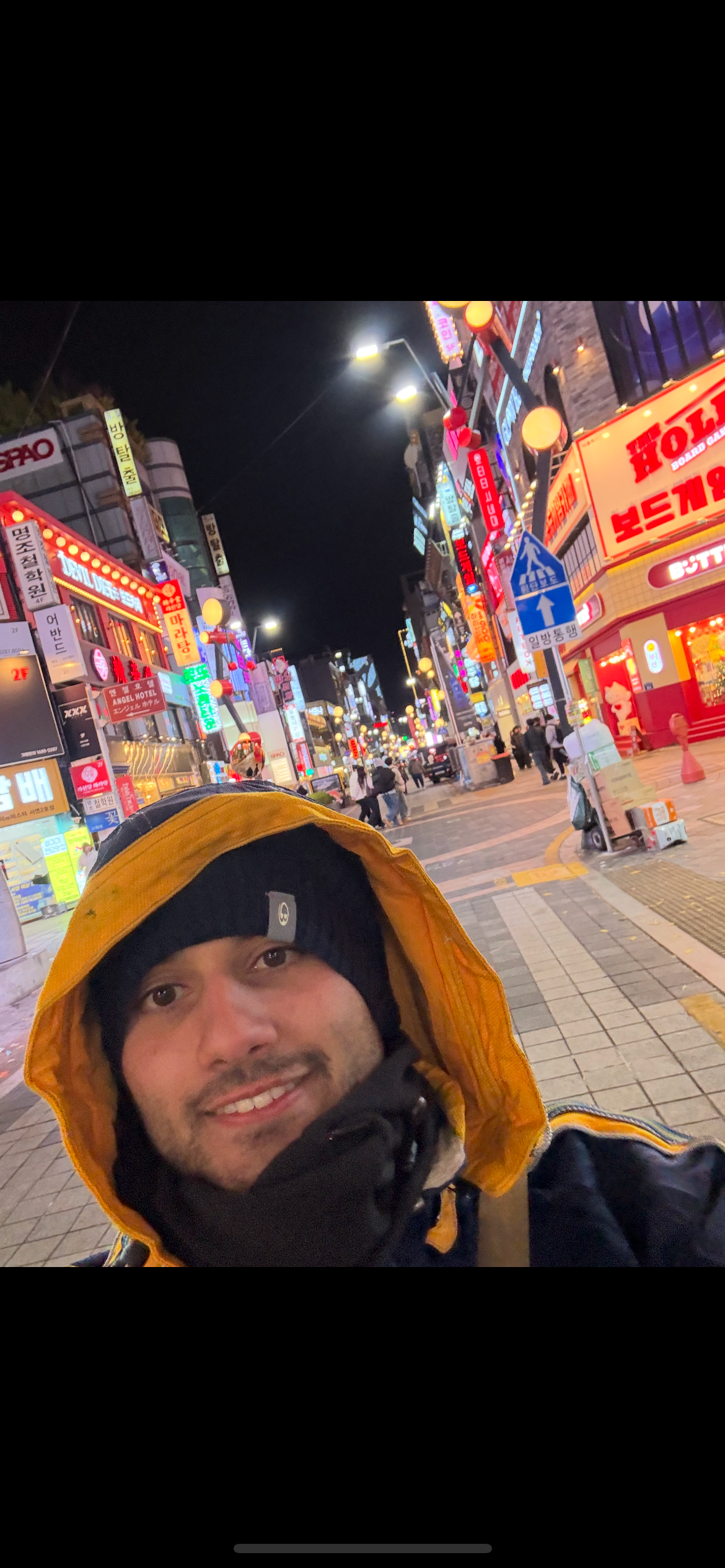 Apart from playing at weddings, Marcus likes to travel. Here is a selfie of him in the bustling neon skyline of Seoul, South Korea