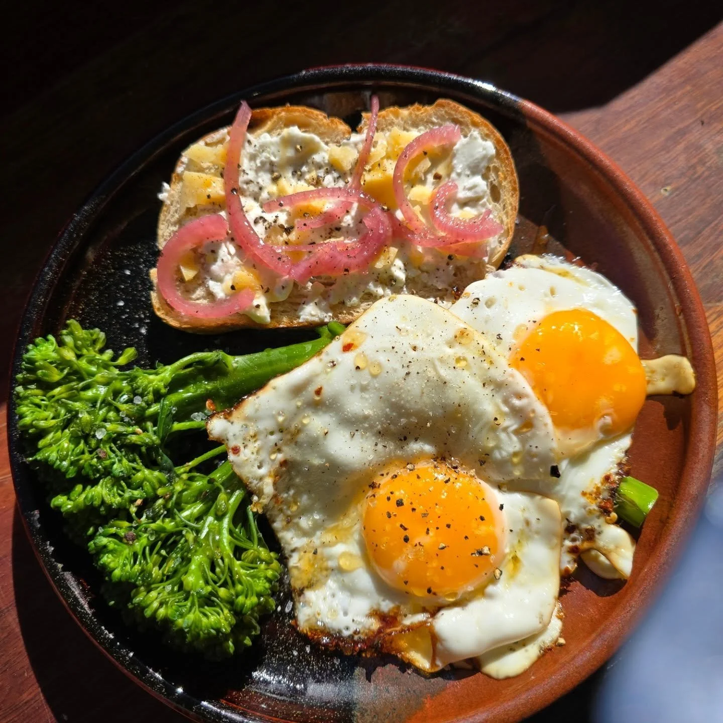 The hold this breakfast has on me...
Sourdough with cottage cheese, ACV pickled onion, and sharp parmesan.
Chilli fried eggs with broccolini.
Honey drizzled over the top.
Usually would also have pickled cucumber.

It's warm, comforting, spicy and swe