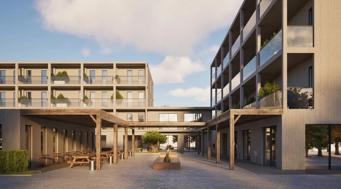 Modern residential building complex with balconies, outdoor benches, trees, and a walkway with wooden pergolas.