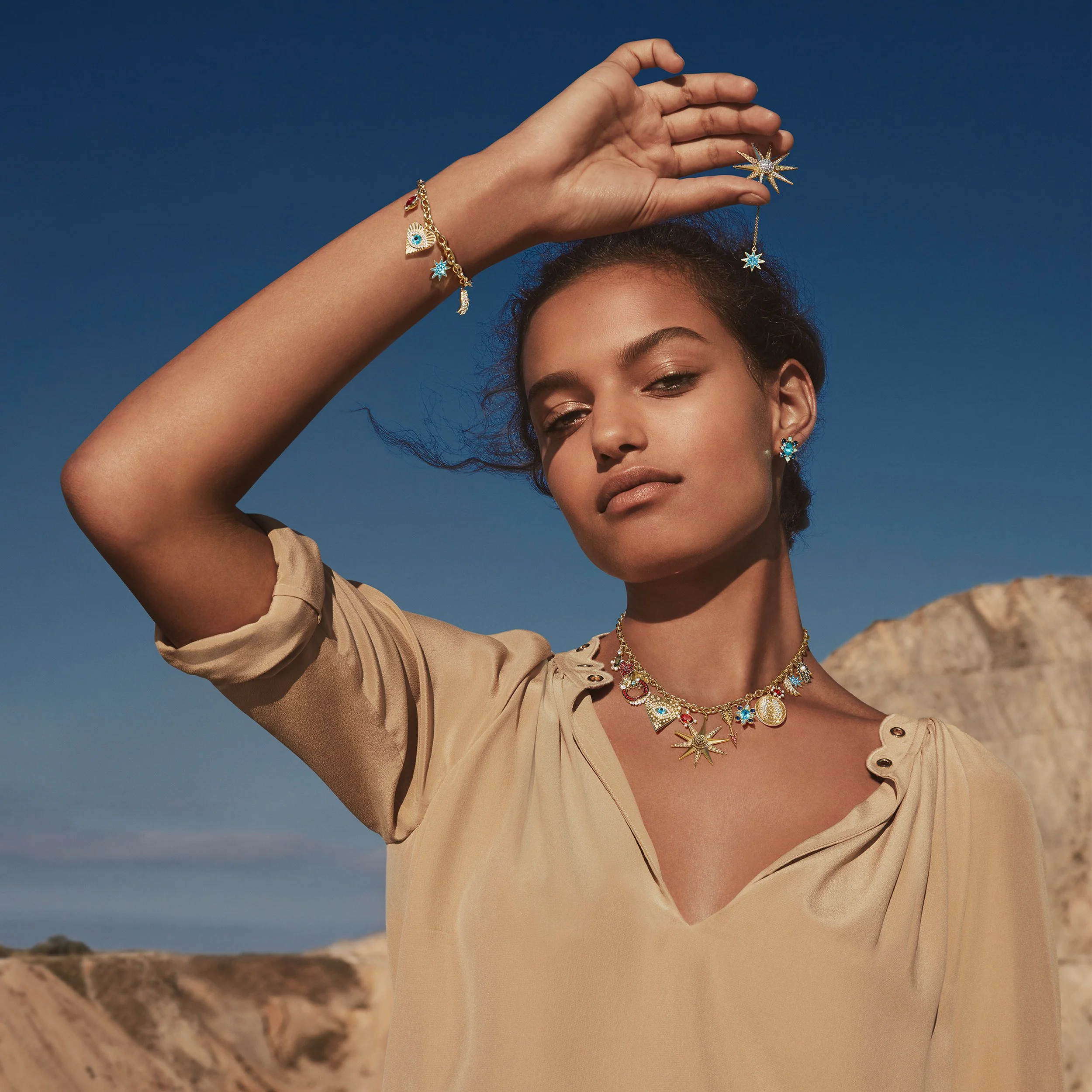 Swarovski model posing with earrings, necklace and bracelet