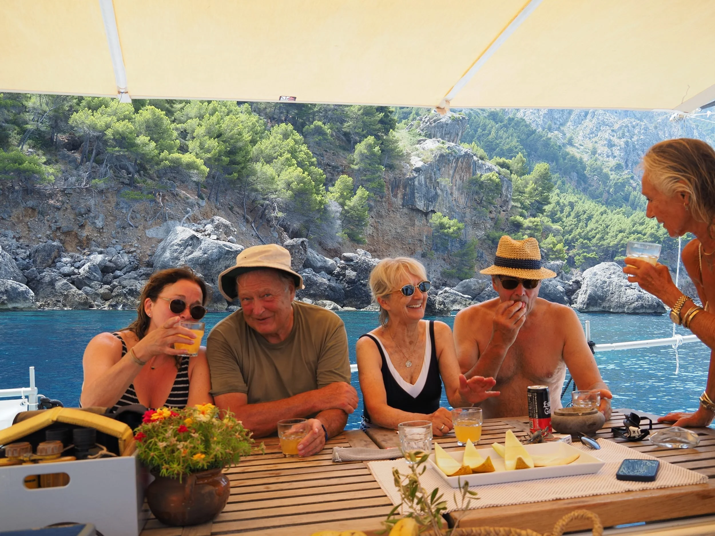 Guests at lunch table on deck Bonnie Lass