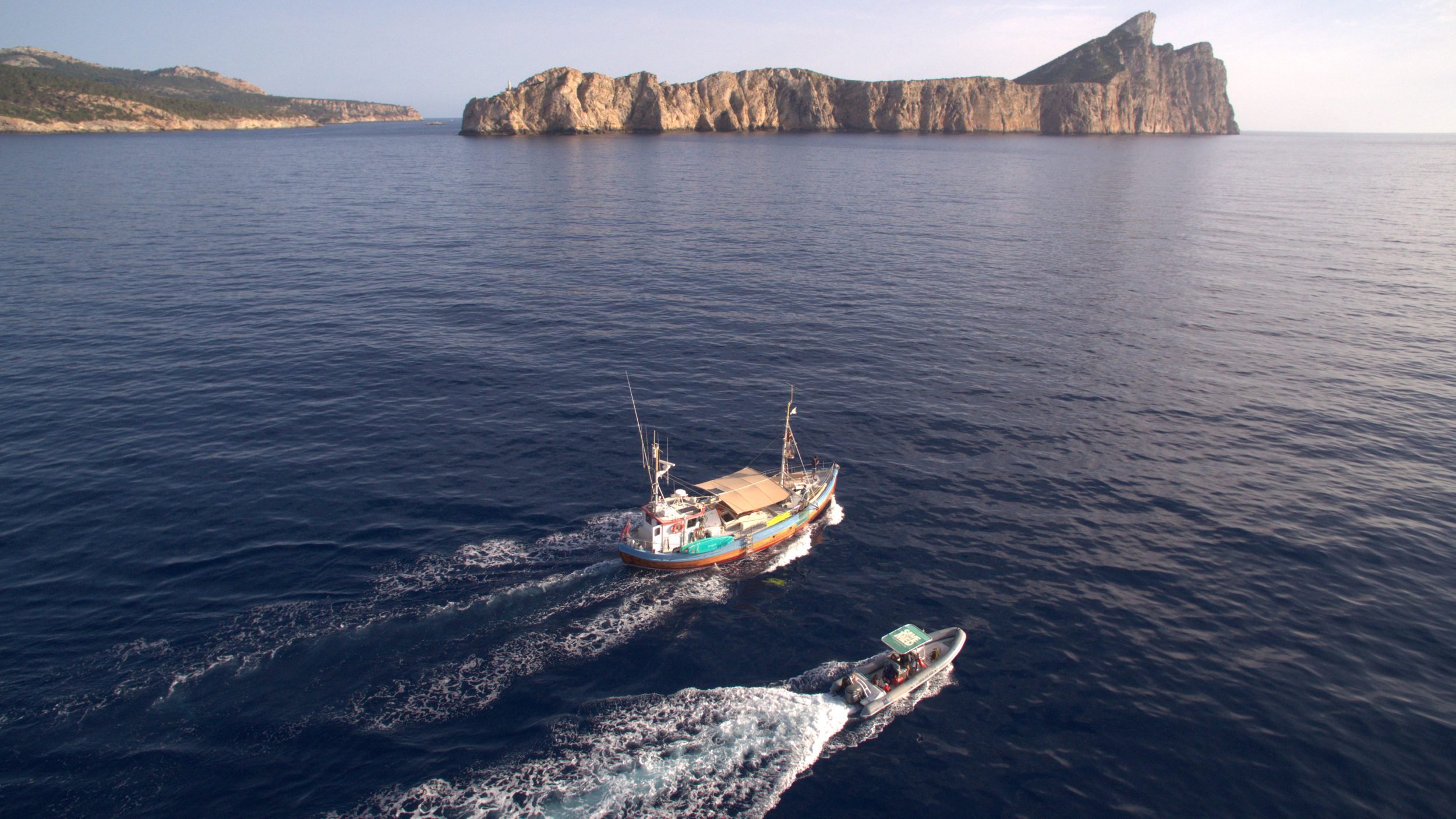 Drone view Bonnie Lass underway headland