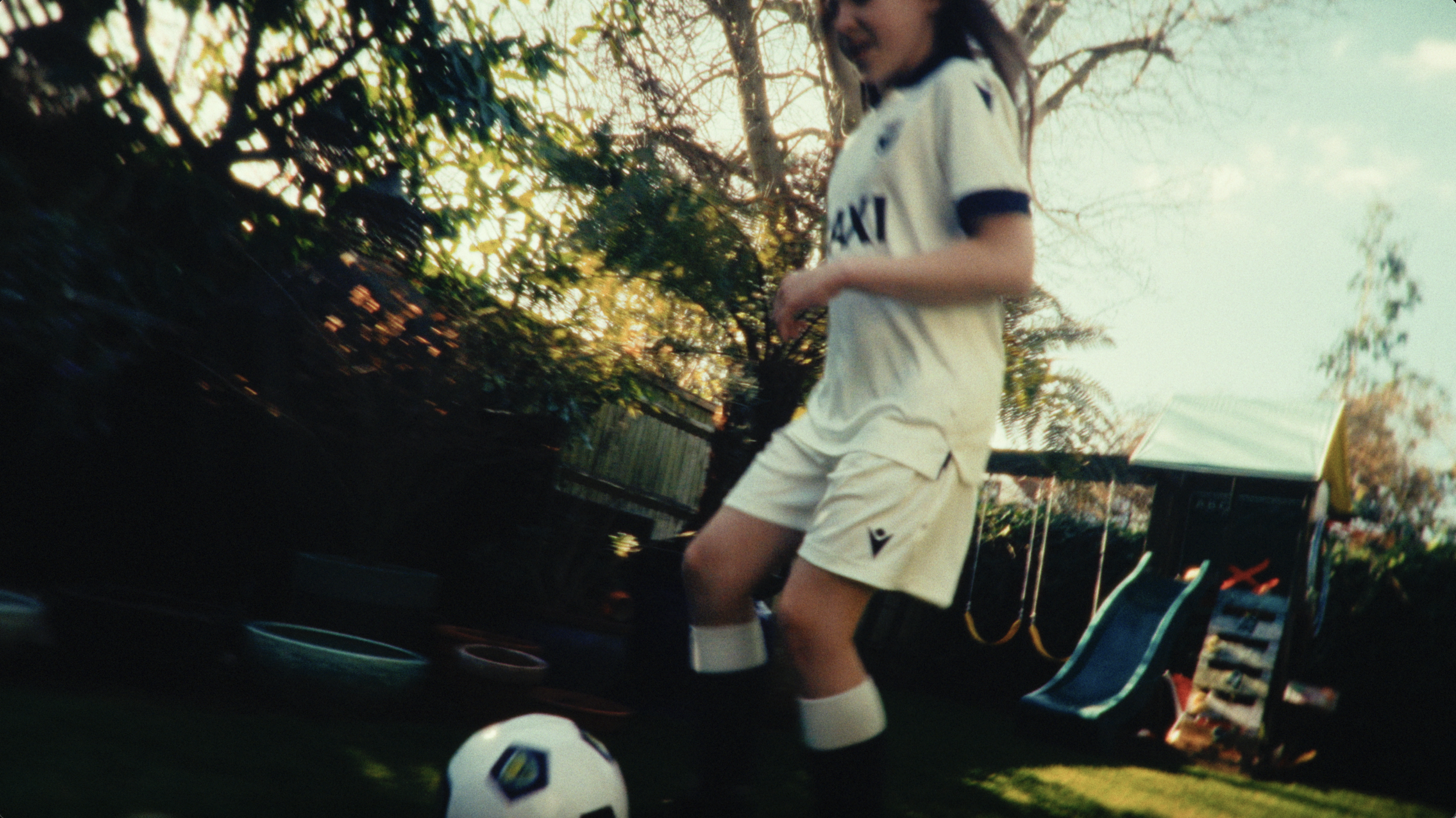 Girl Playing Football.png