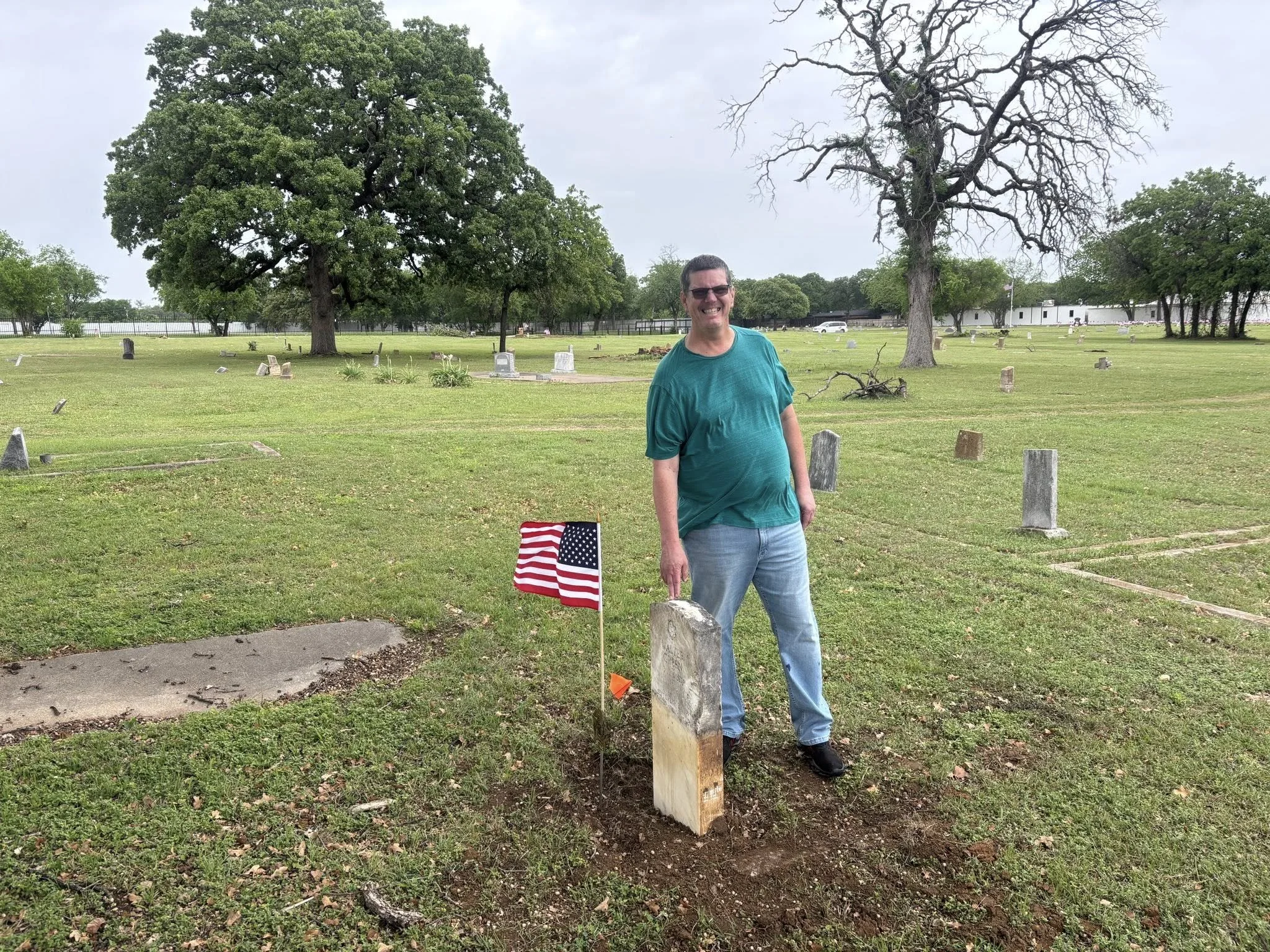 Community Volunteer at Raised Grave Site.jpg
