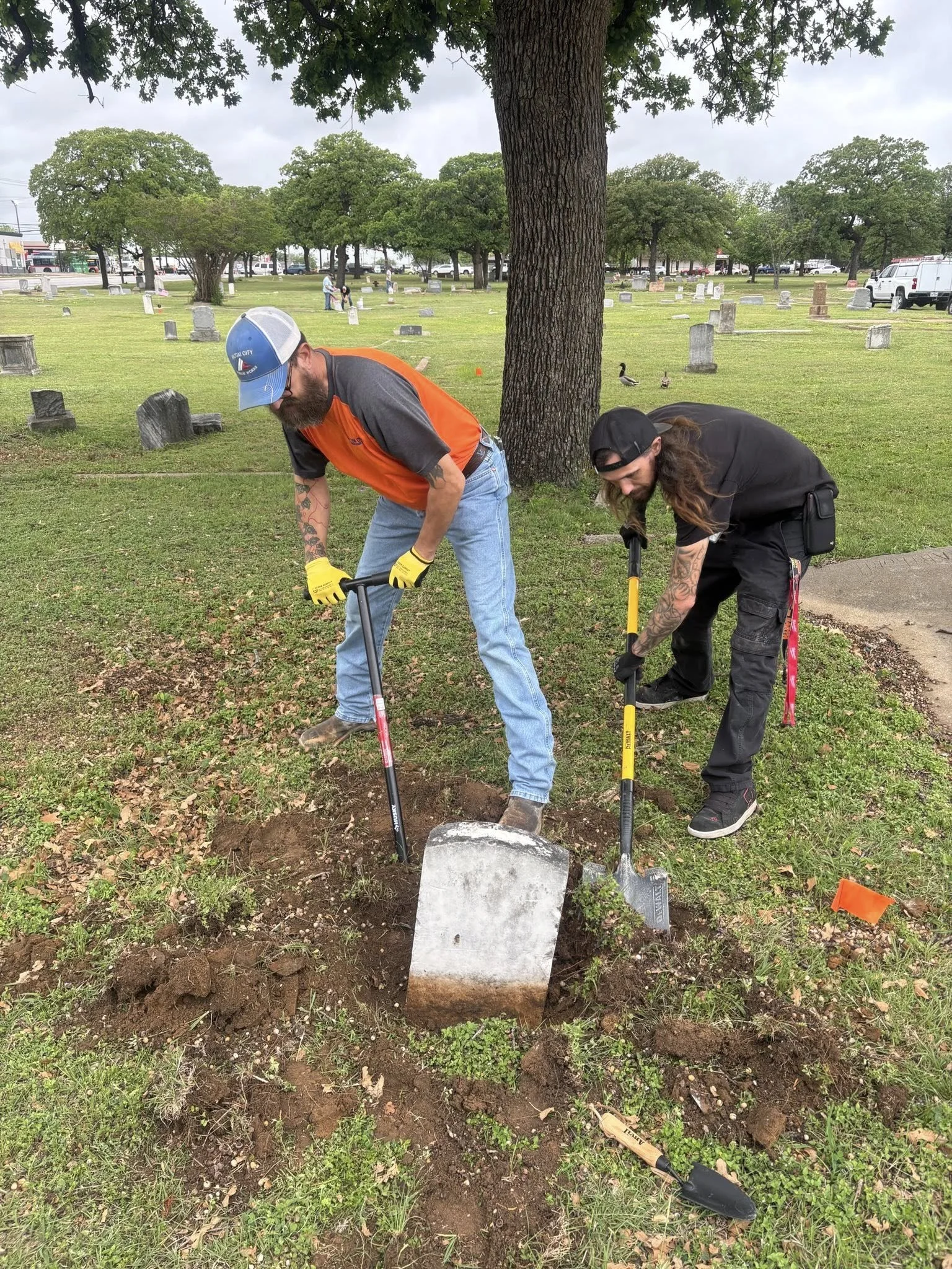 Haltom City Workers Volunteer Resetting Sunken Graves.jpg