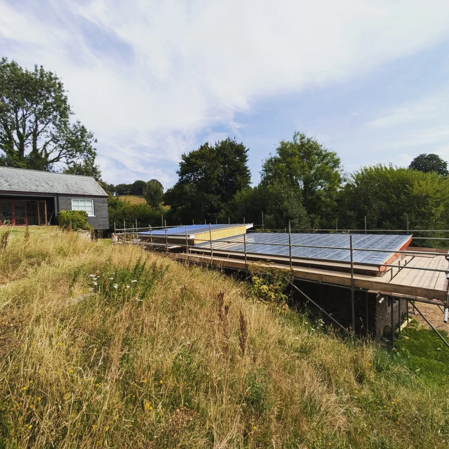 Site progress

Standing seam roof almost complete, internal stud partitions in and first fix underway.

Beginning to look sharp against the idillic surrounding countryside.

The postbox red is wrong and will be Dark Stallion no1 or maroon as we all c