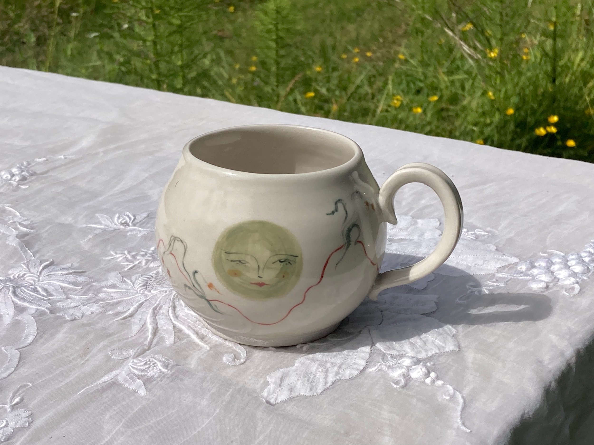 green moon among flowers mug
