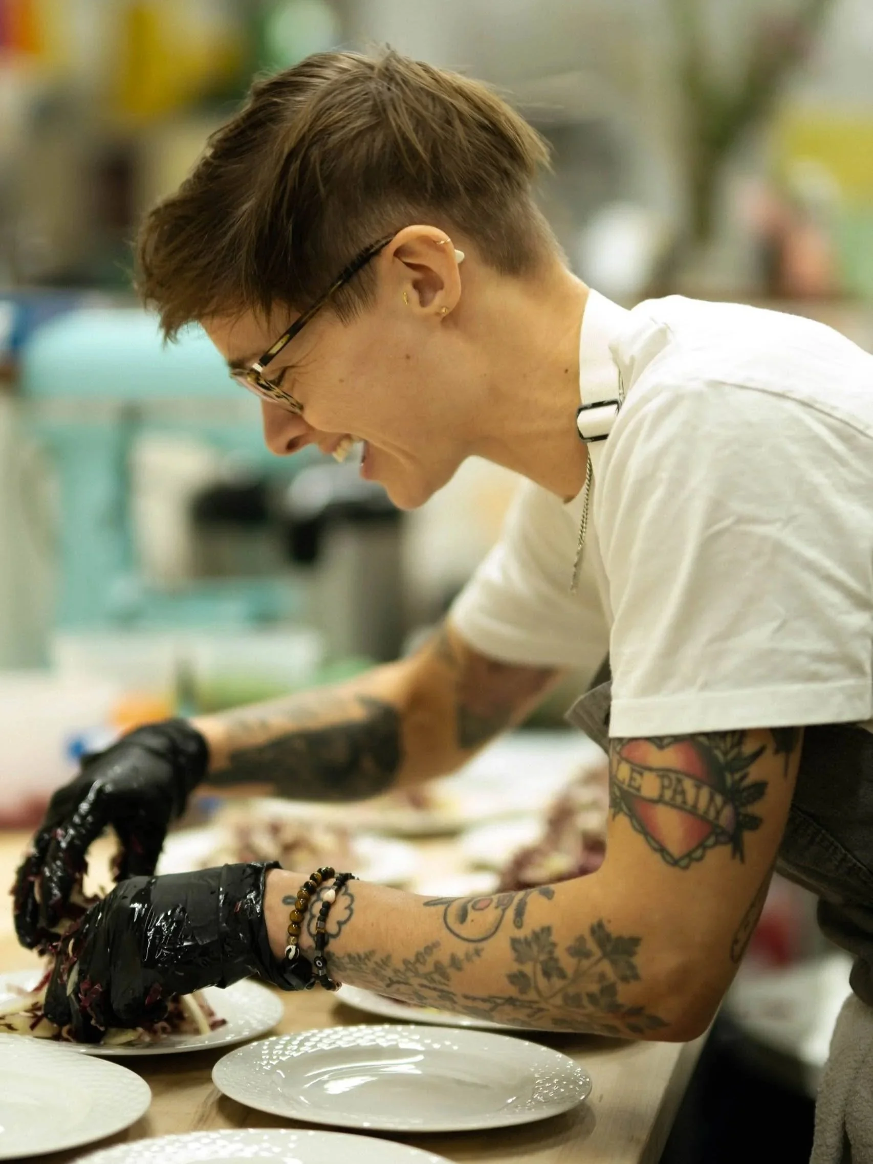 chef plating food in a gourmet kitchen