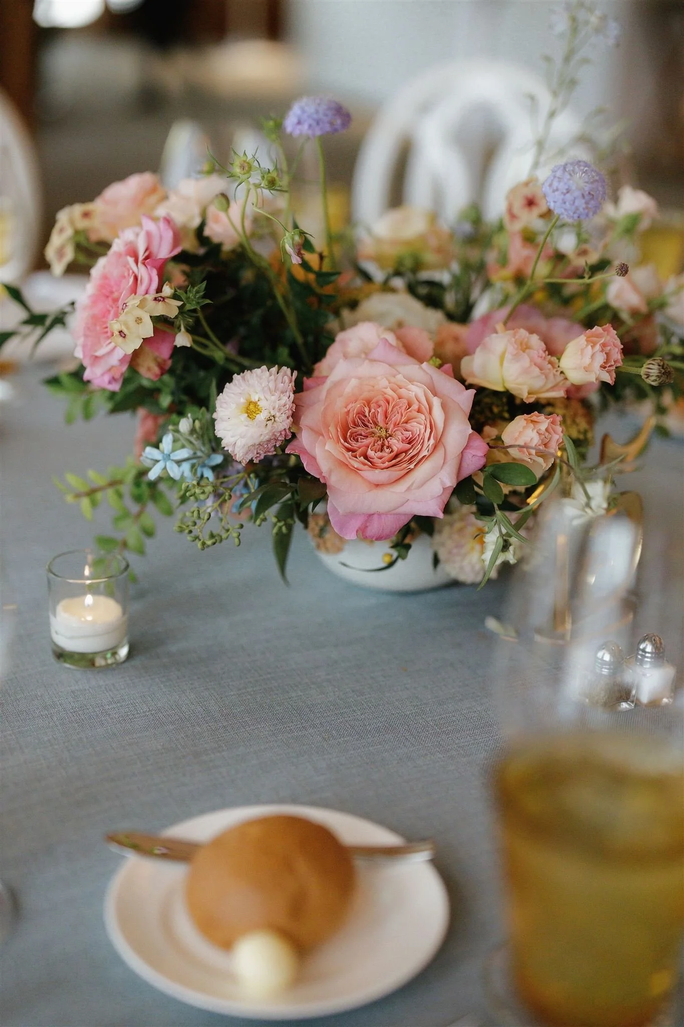 Wedding reception at Sharon Heights Country Club in Menlo Park, California, with elegant table settings and lush floral centerpieces of garden roses, scabiosa, and seasonal flowers in soft romantic tones.