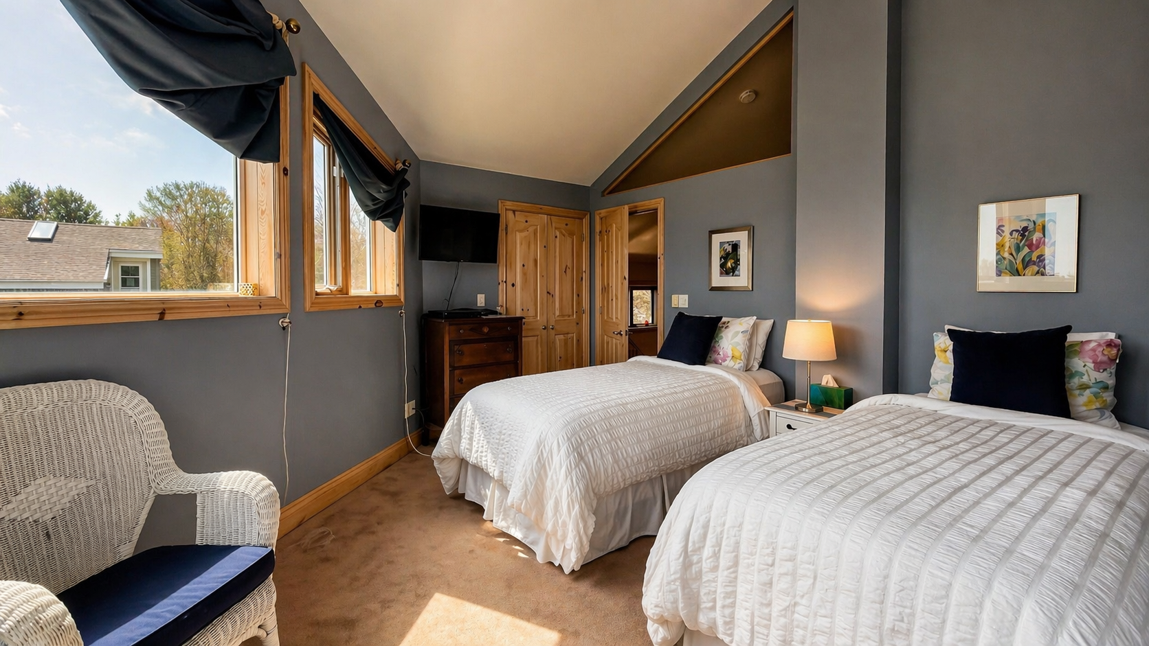 Sky Room at Chalet Recording Studio with two twin beds and large windows offering a stunning natural view