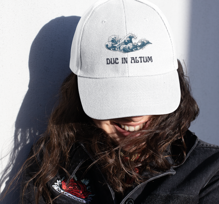 Woman wearing a RosaryMinded hat