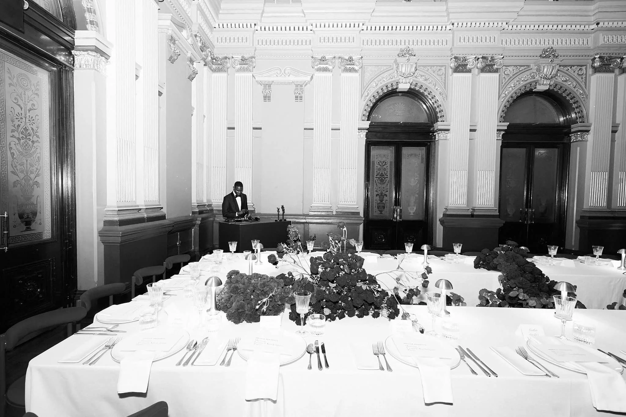Elegant banquet hall with decorated tables and a DJ playing music in the background for Francis Kadijan x MECCA