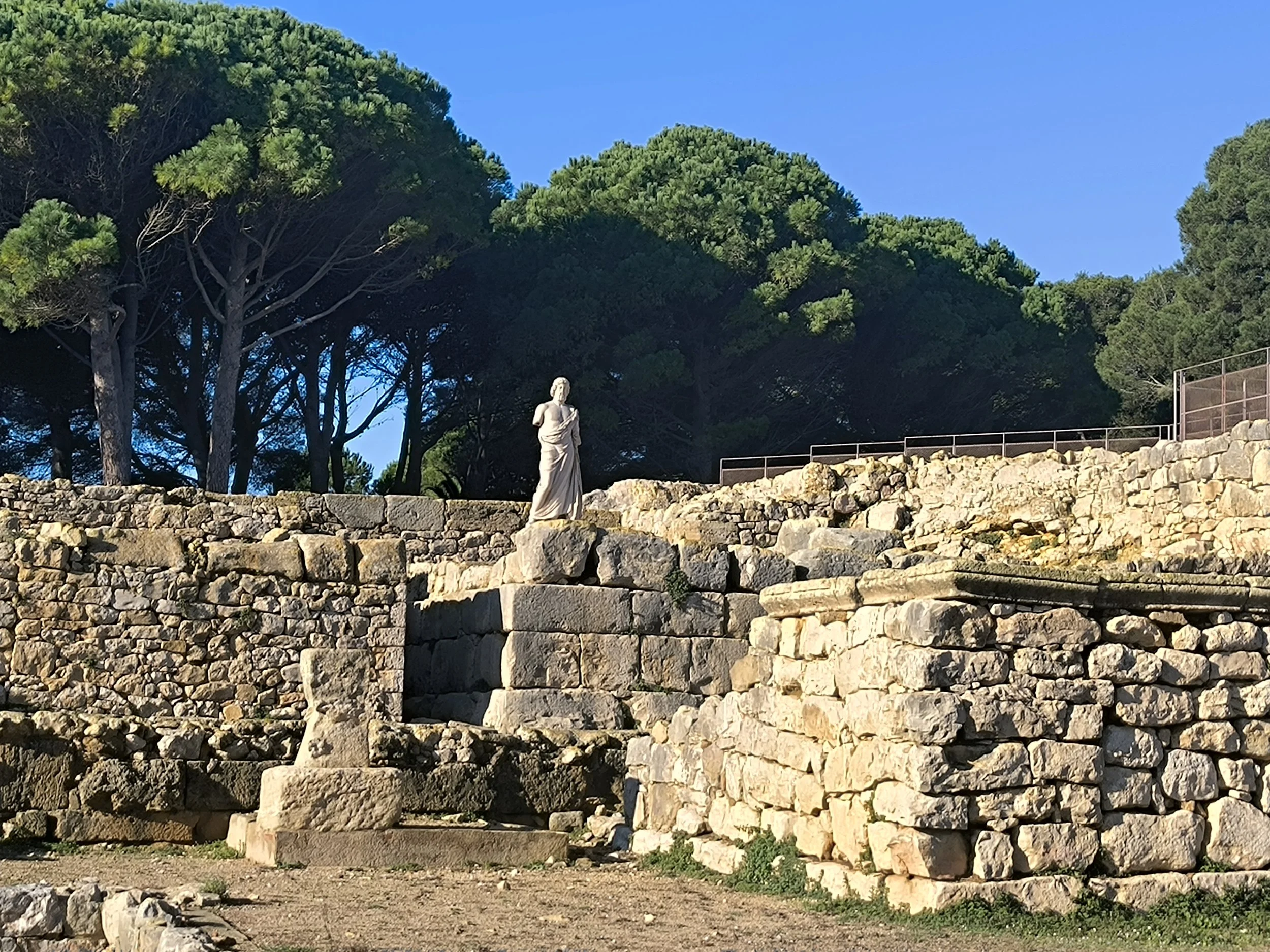 Greek God of healing Asclepius statue at the archaeological site Empúries in Catalonia, Spain.