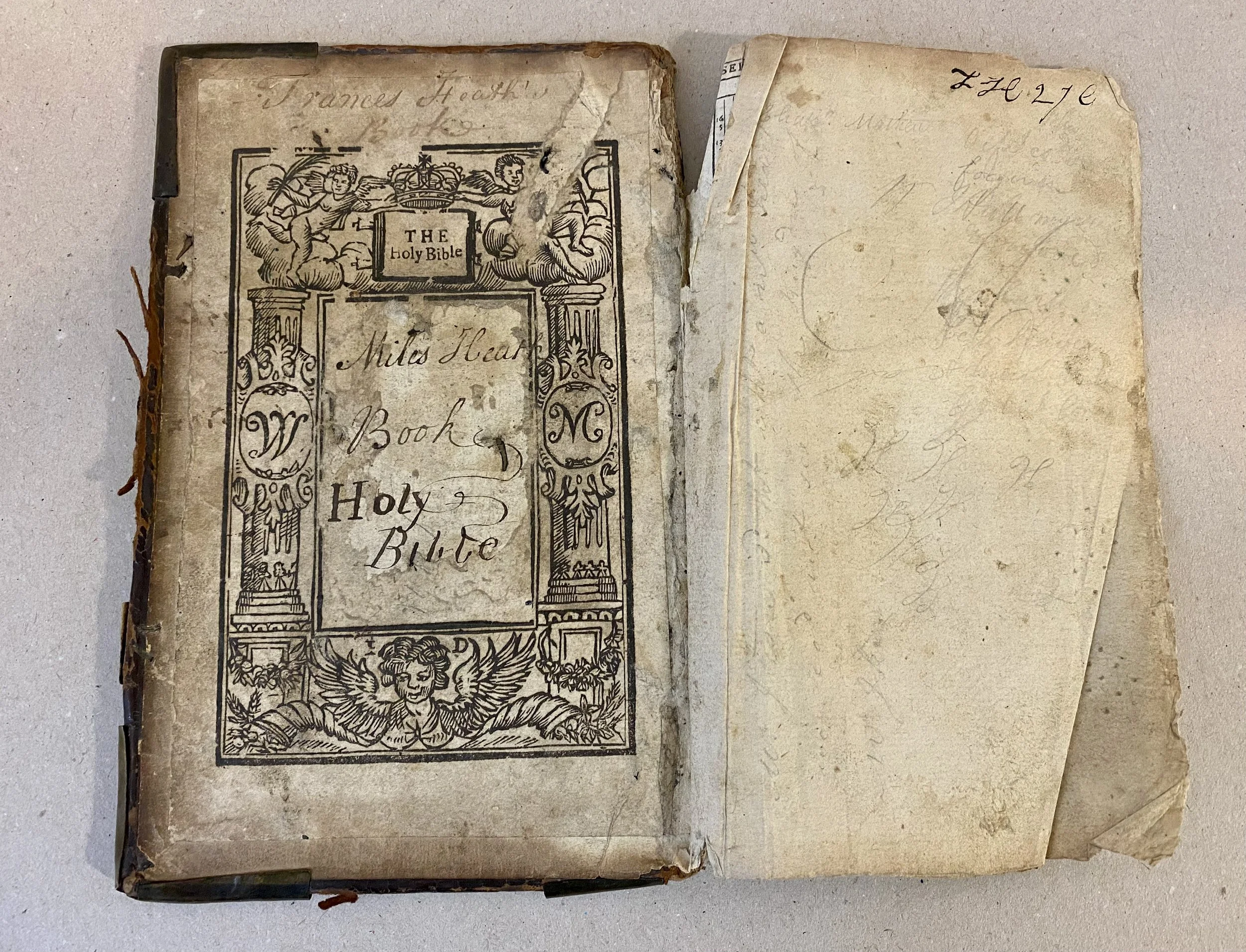 Loose board of 18th century bible with damaged endpapers