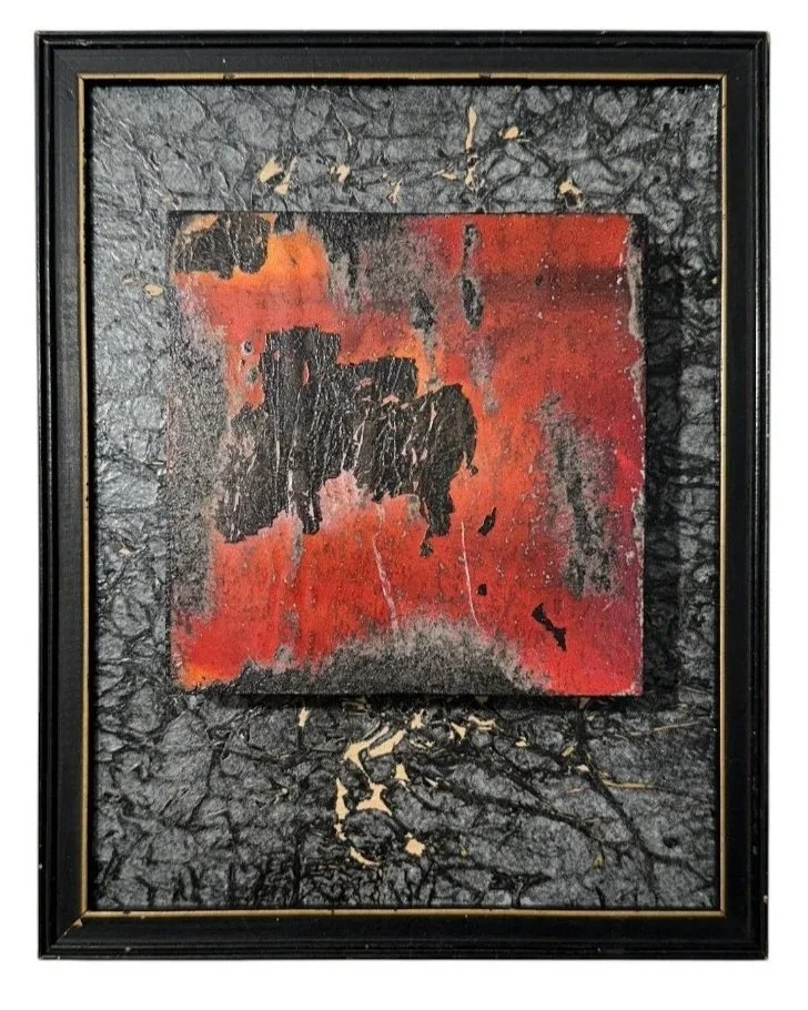 Residual Heat mixed media assemblage with layered red and black textured surfaces