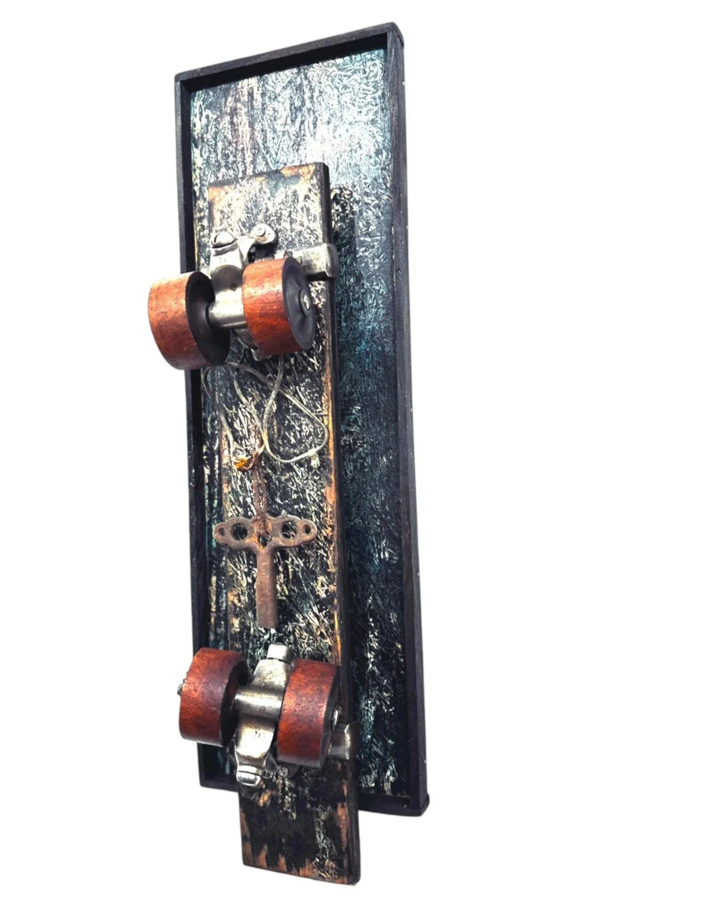 Alternate angled view showing inset panel depth, visible skate key with wire, and wheel protruding from side
