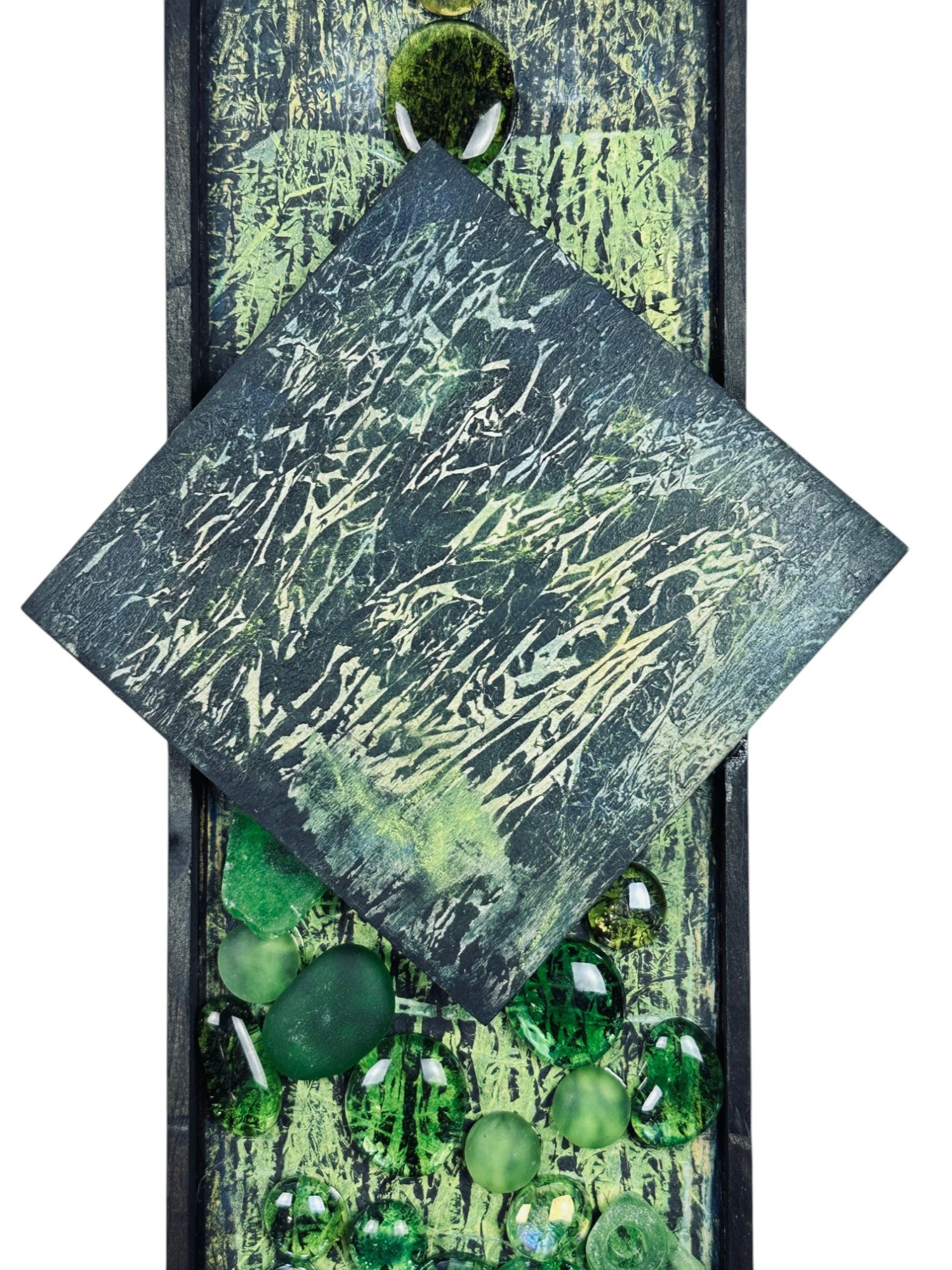 Top-down view showing the central square panel and upper embedded oval elements