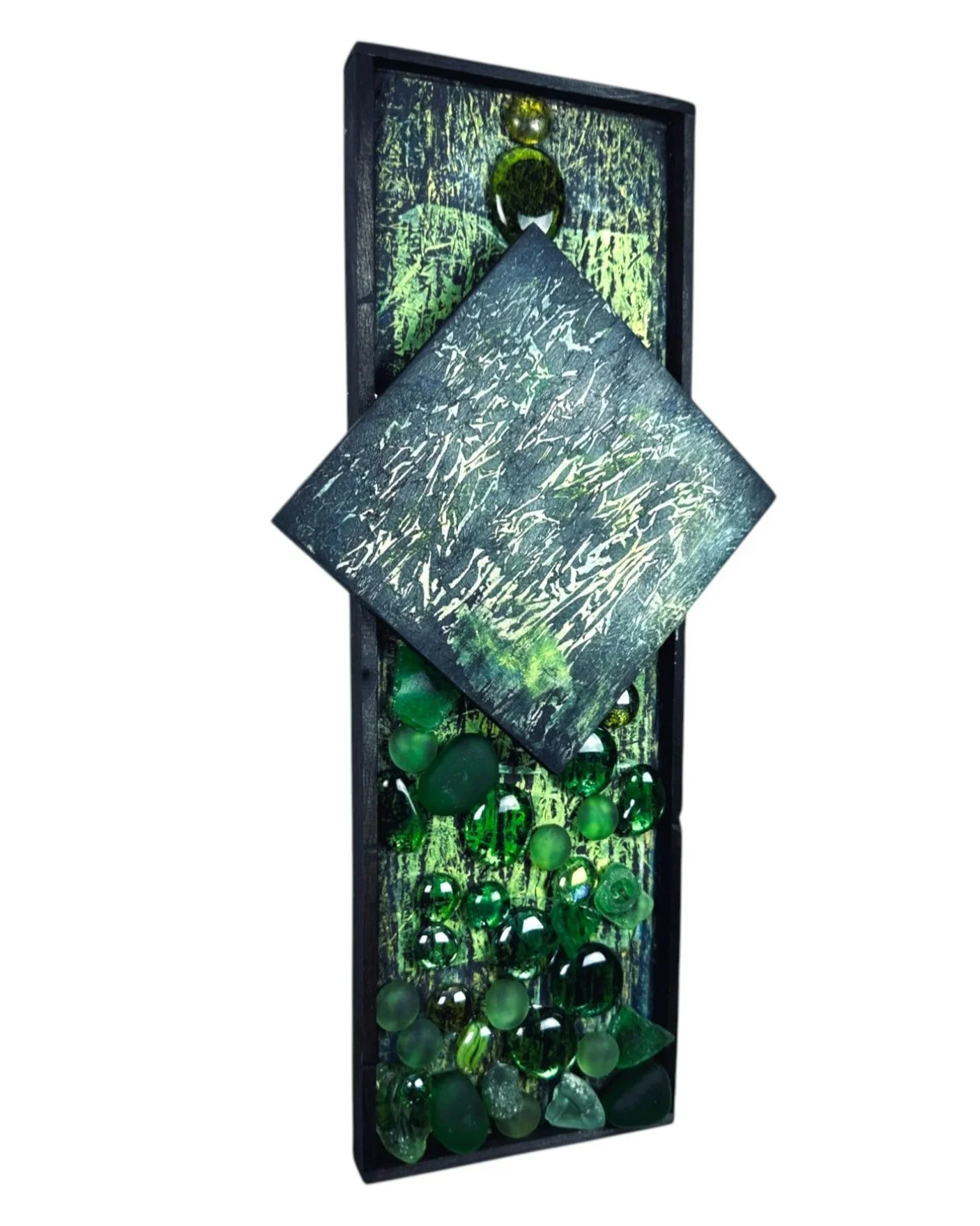 Angled side view showing the dimensionality of the central textured panel and glass elements below