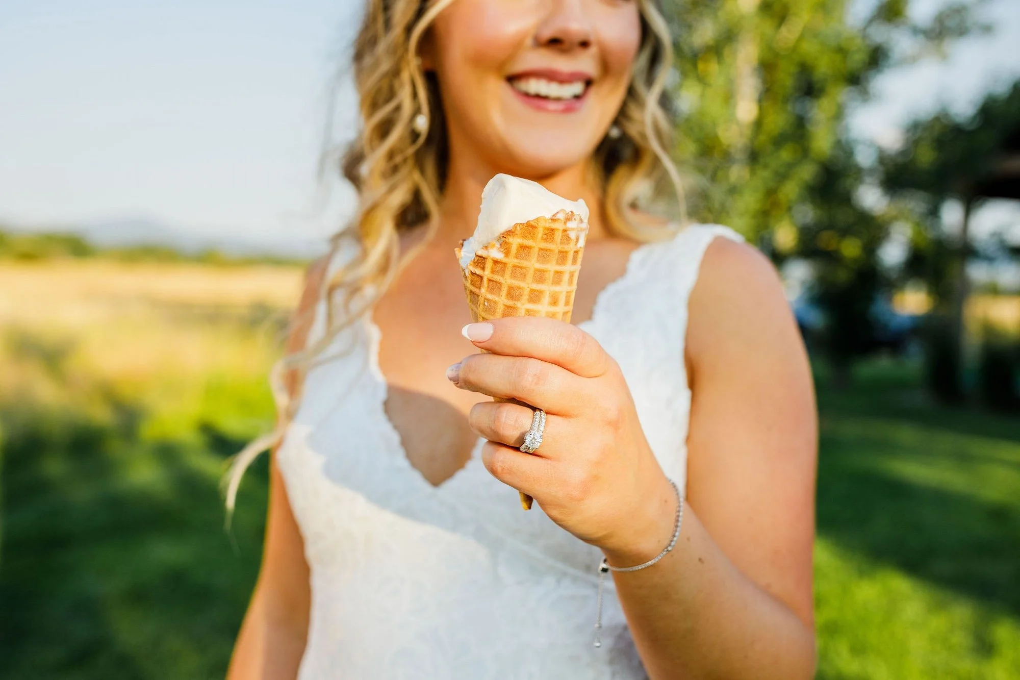 a bride enjoying ice cream on her wedding day