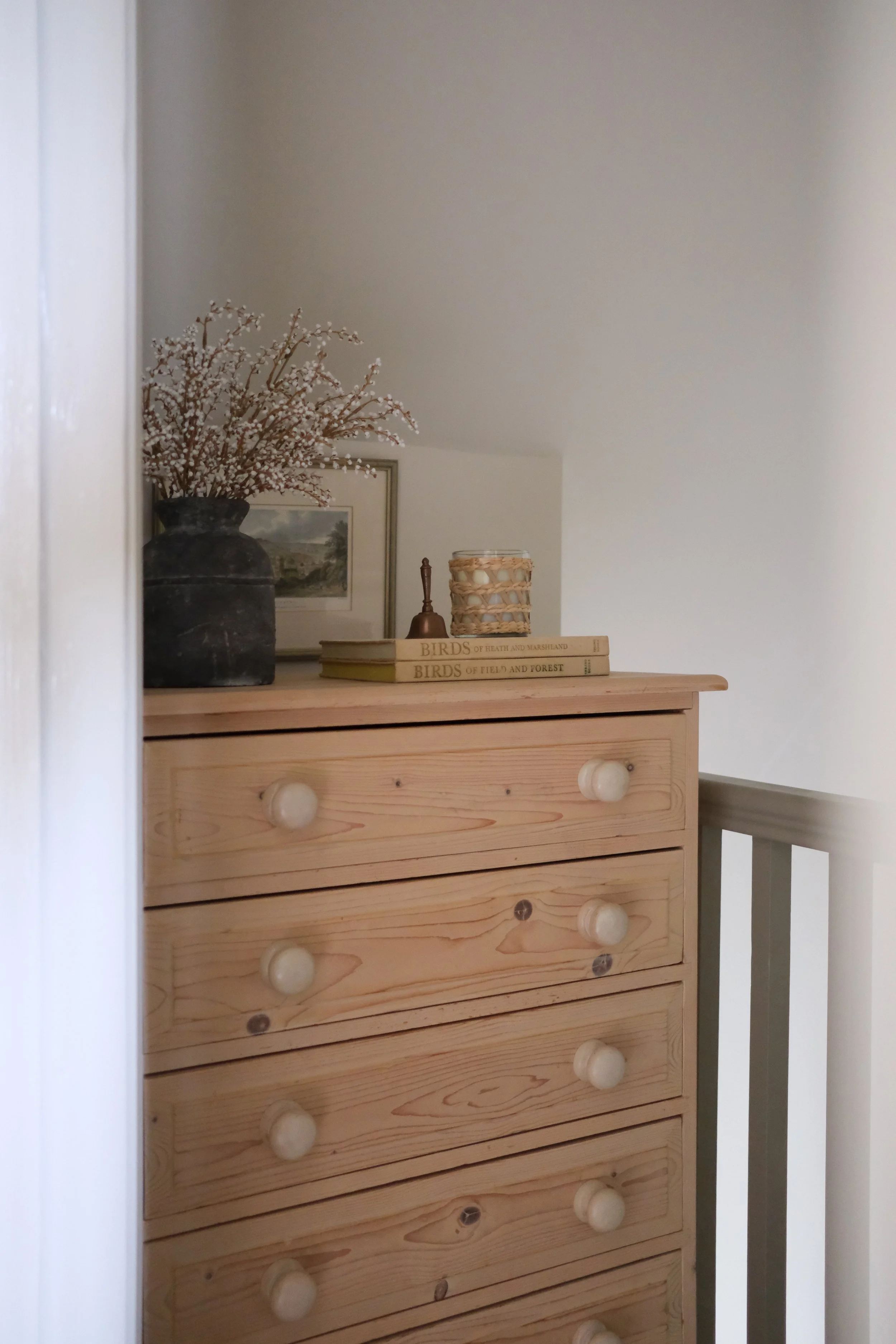 Oxford and Cotswolds interior designer styling rustic wooden dresser with books and decorative accents