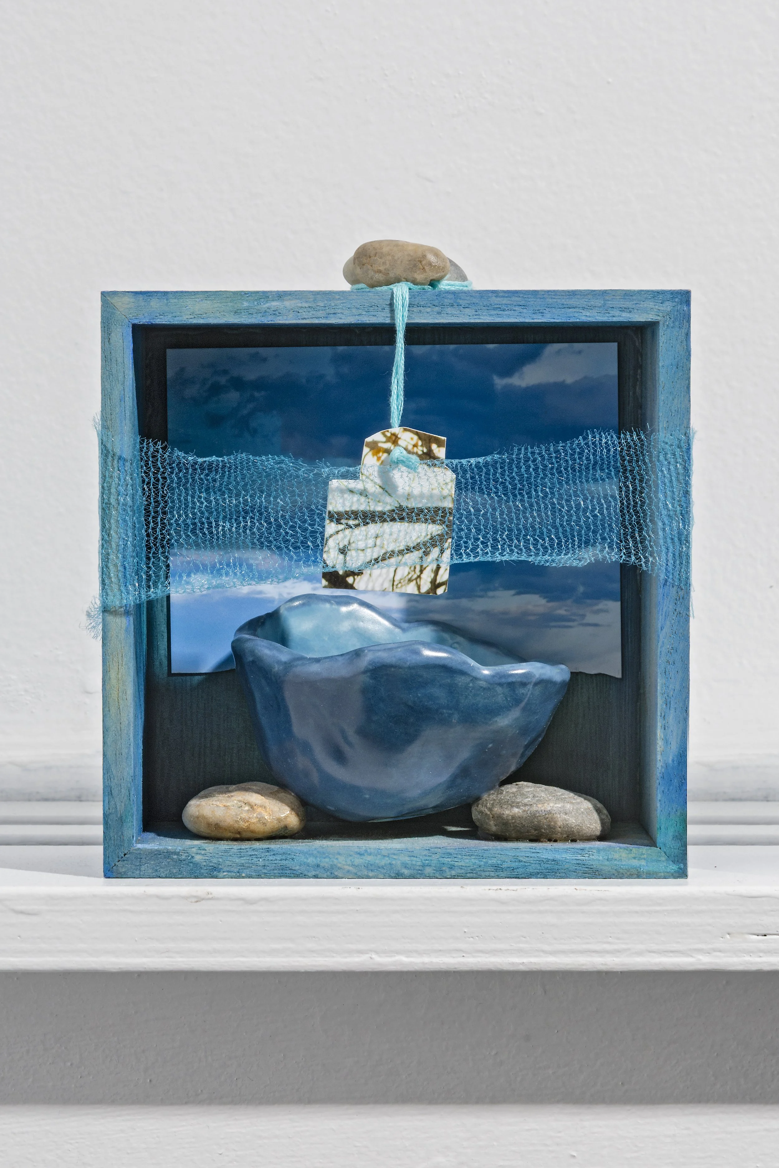 Melinda Kiefer Santiago,
Earth Aid, ceramic, stones, digital prints, repurposed fabric, acrylic, wood, 5 x 5 x 2 inches.