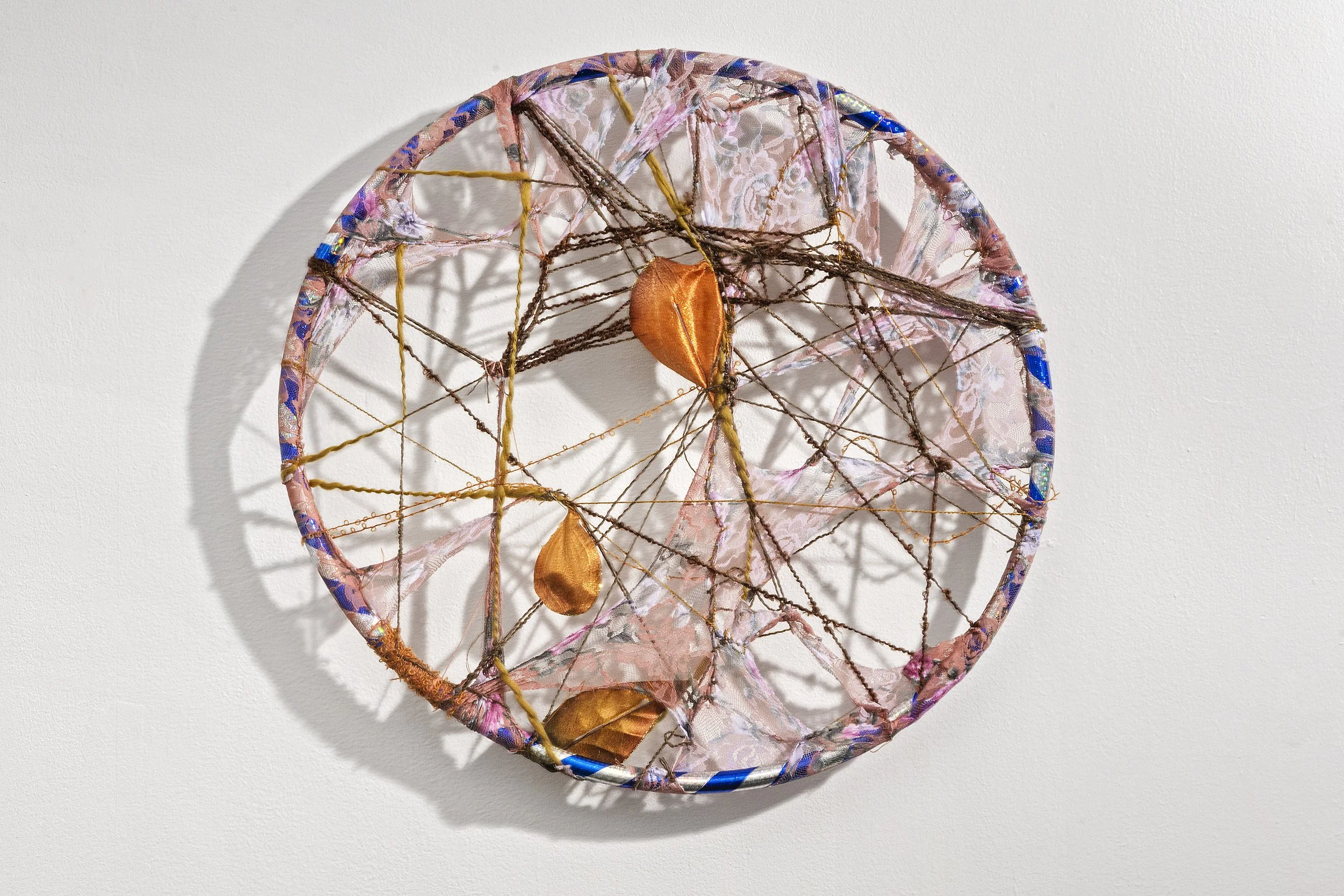 Yasmeen Abdallah,
Ground, 2025, Embroidery and picnic remnants with dirt on fabric with trim, 10 ft x 3 ft.