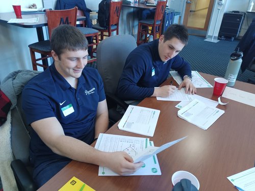 Delts work on a Belbin Team mapping project during the training.